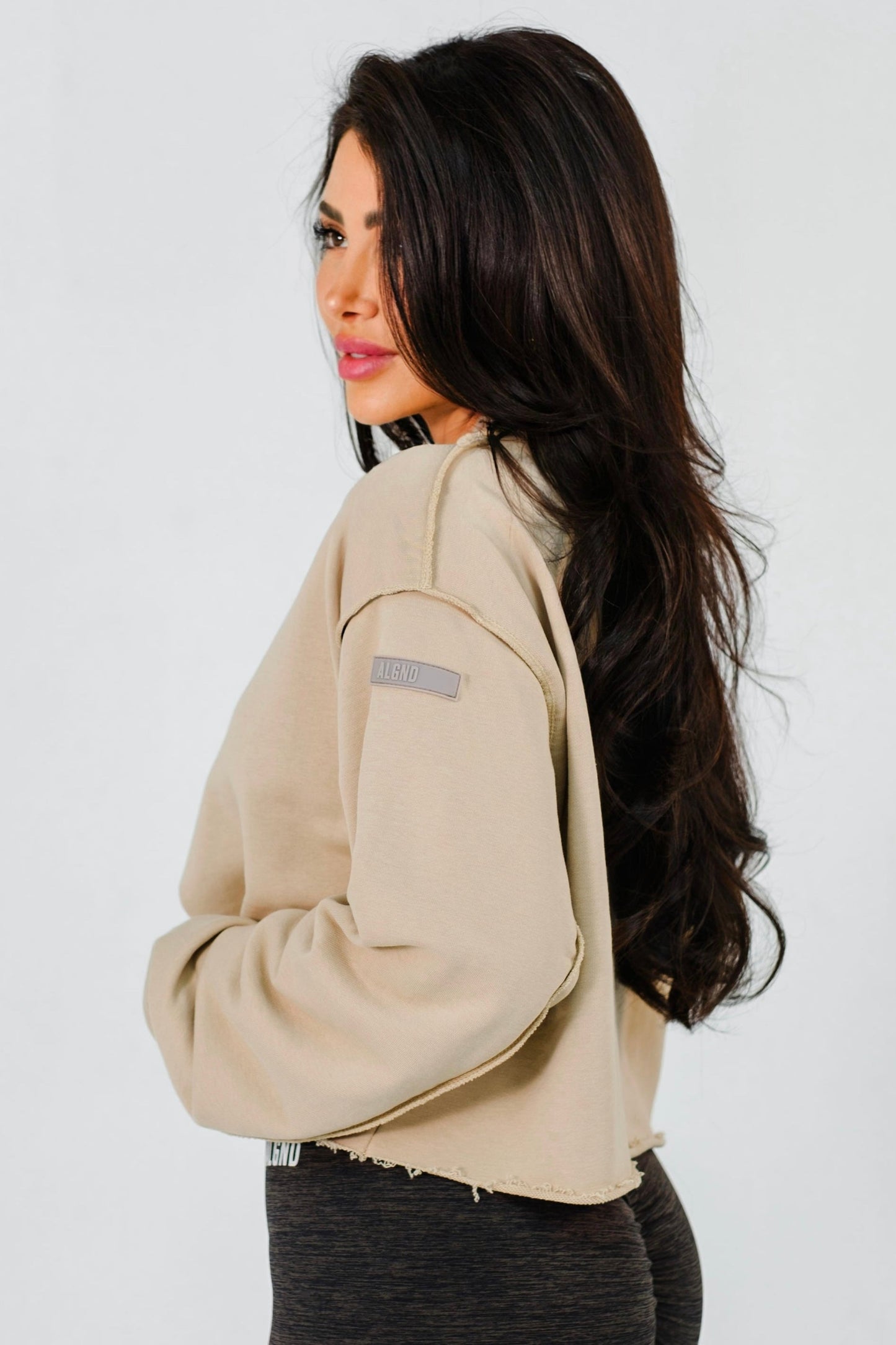 Tan crop sweatshirt with inside out seam detail